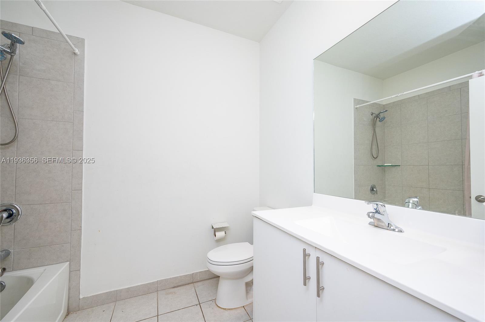 23061 Southwest 128th Place Miami, FL 33177 - Photo 20 of 28 a bathroom with a sink a toilet and shower