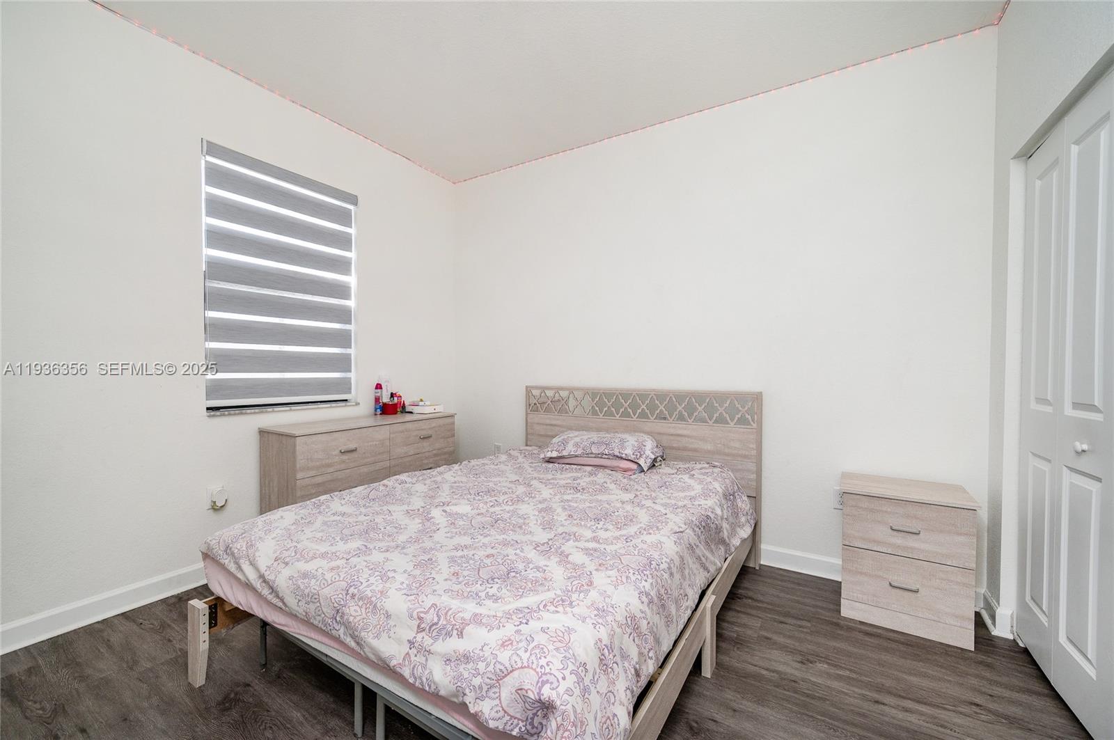 23061 Southwest 128th Place Miami, FL 33177 - Photo 22 of 28 a bedroom with a bed and a dresser