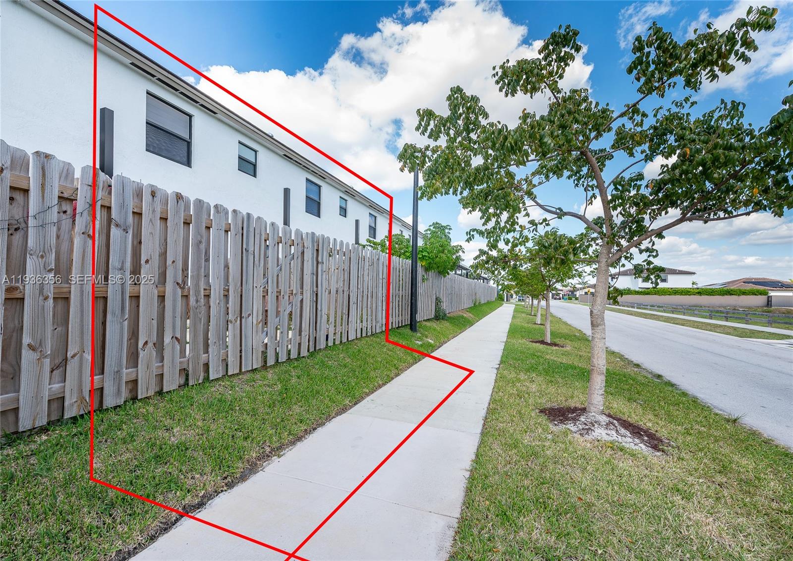 23061 Southwest 128th Place Miami, FL 33177 - Photo 26 of 28 a view of a backyard with wooden fence