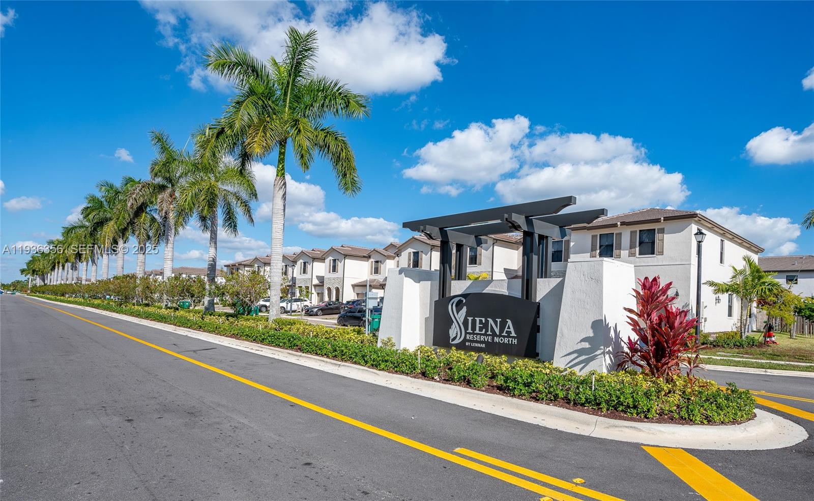 23061 Southwest 128th Place Miami, FL 33177 - Photo 28 of 28 a front view of a house with a yard and potted plants