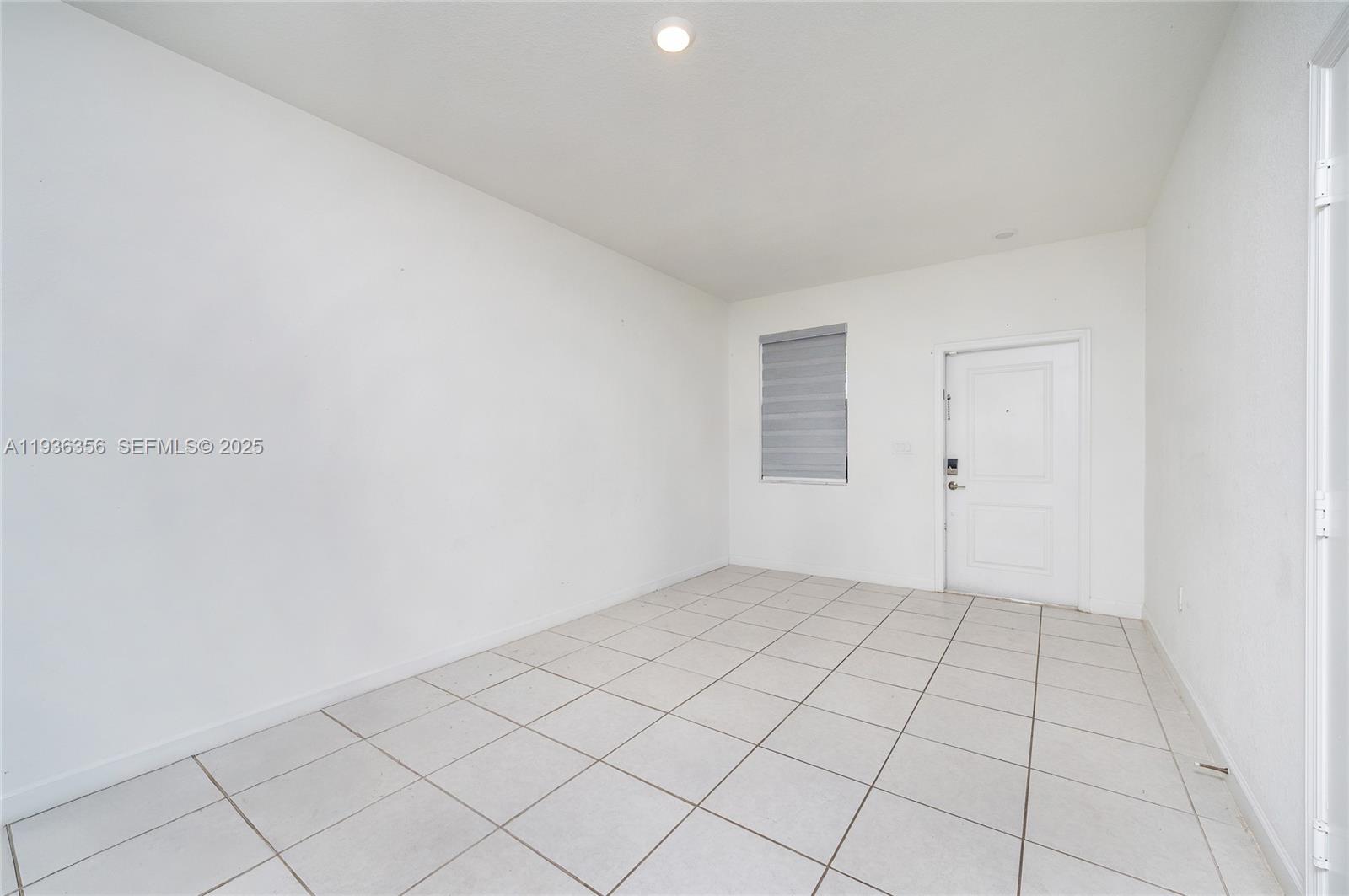 23061 Southwest 128th Place Miami, FL 33177 - Photo 3 of 28 a view of an empty room
