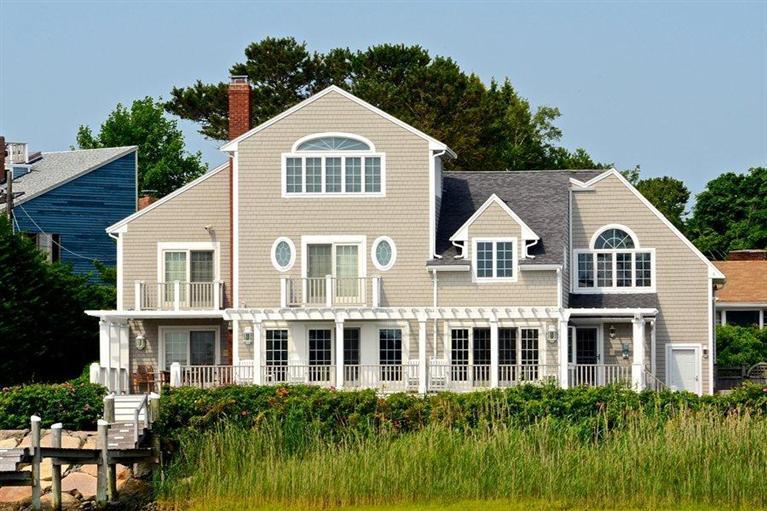 12 Bay Shore Road Hyannis, MA 02601 - Photo 3 of 16 a front view of a residential houses with yard and green space