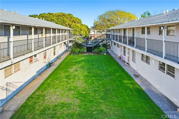 a view of a house with backyard and porch