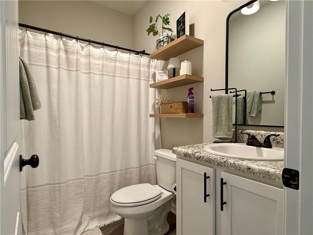 1776 Pleasant Grove Road Temple, GA 30179 - Photo 25 of 45 a bathroom with a sink toilet and shower