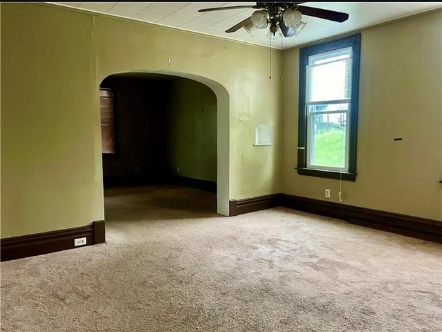 a view of a storage & utility room with a window