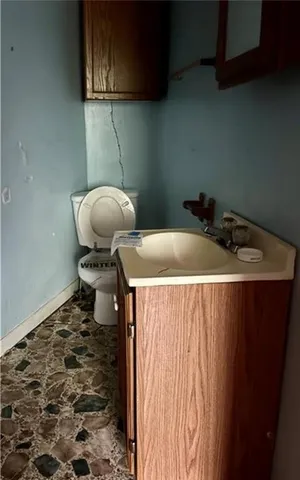 a bathroom with a toilet and a bathtub