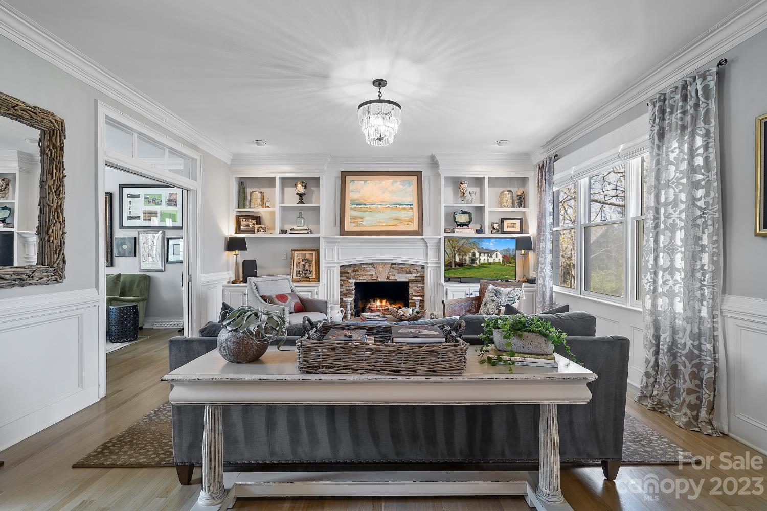 4612 Binfords Ridge Road Charlotte, NC 28226 - Photo 13 of 48 a living room with furniture a fireplace and a window