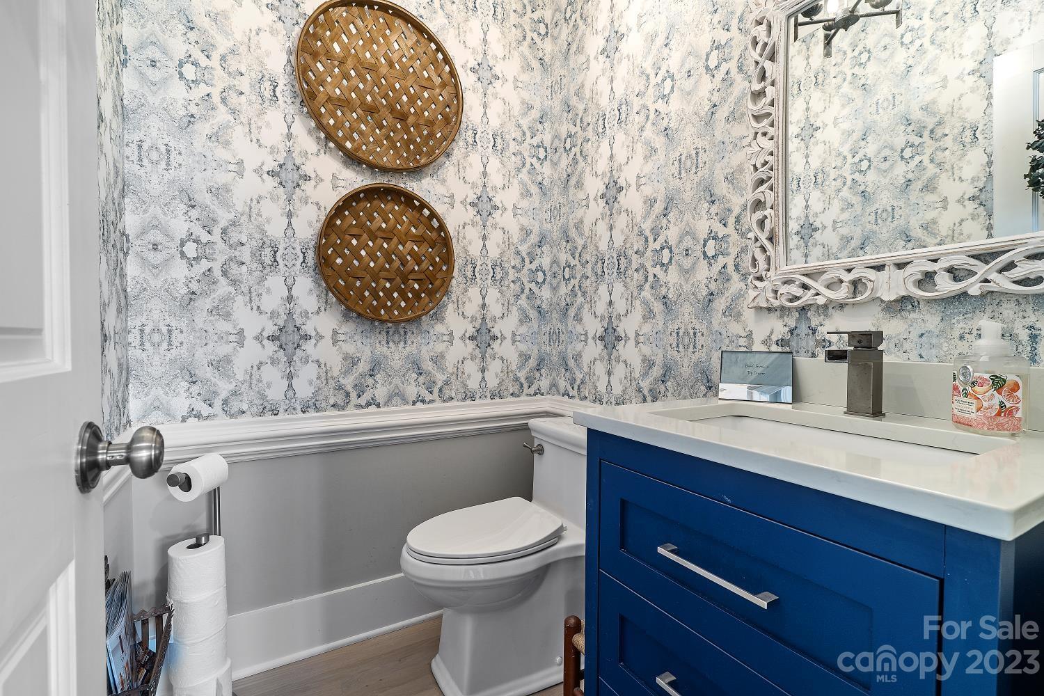 4612 Binfords Ridge Road Charlotte, NC 28226 - Photo 24 of 48 a bathroom with a toilet a sink and mirror