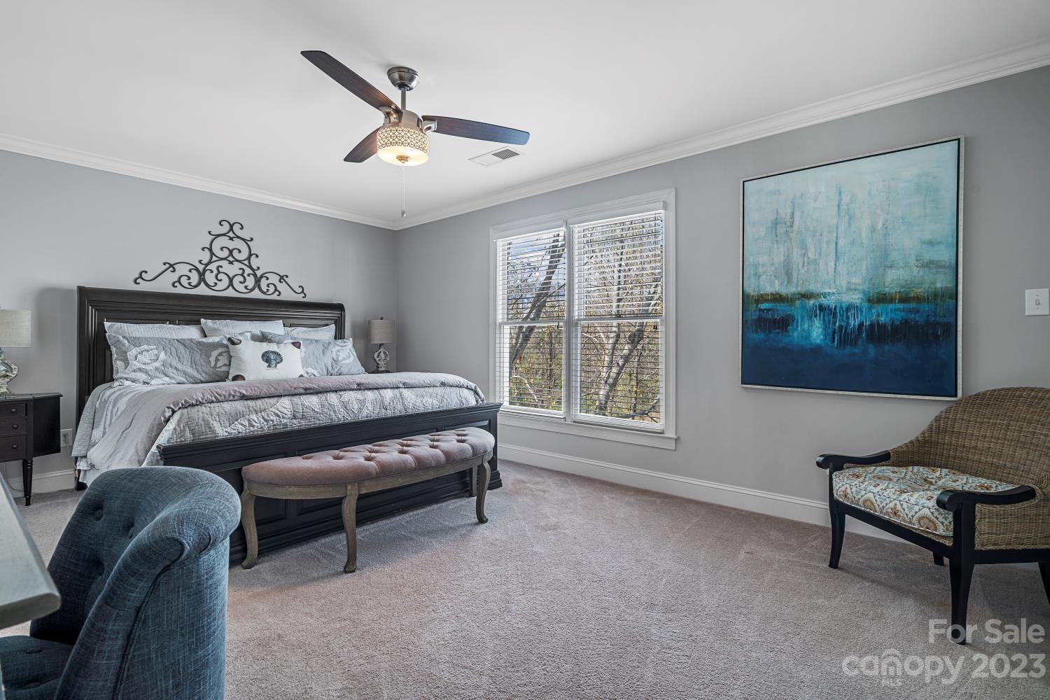4612 Binfords Ridge Road Charlotte, NC 28226 - Photo 42 of 48 a bedroom with a bed a couch and a window