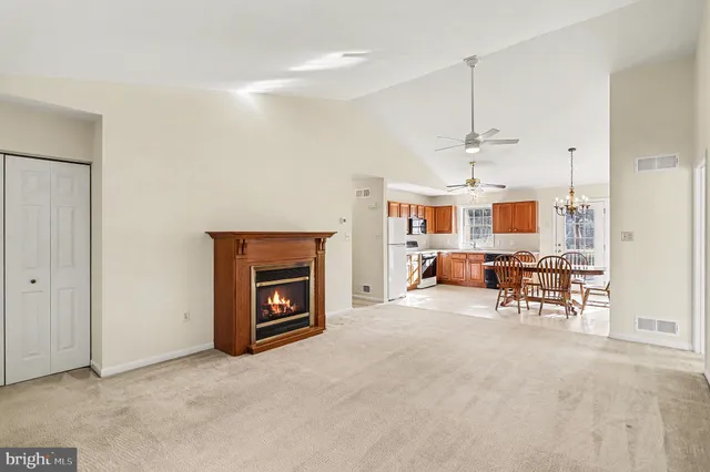 a view of a livingroom with furniture and a fireplace
