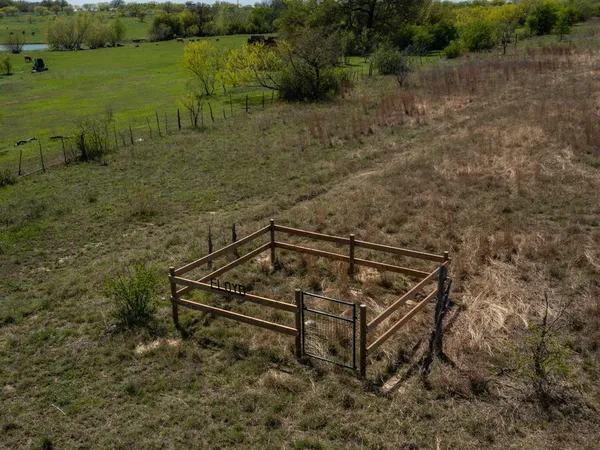a view of a field with an ocean
