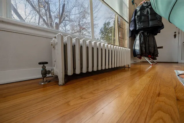 a view of a room with wooden floor and stairs