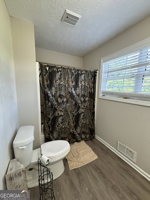 771 Hamilton Road Concord, GA 30206 - Photo 26 of 30 a bathroom with a toilet and a shower