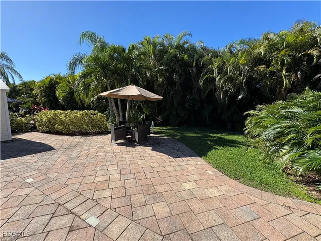 a view of a backyard with sitting area