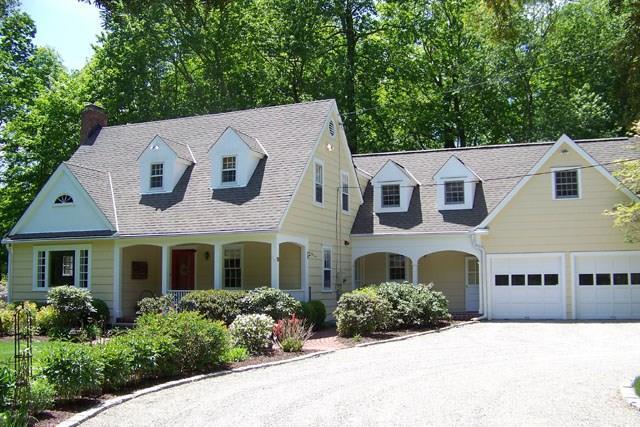 19 Overidge Lane Wilton, CT 06897 - Photo 1 of 1 a front view of a house with a yard