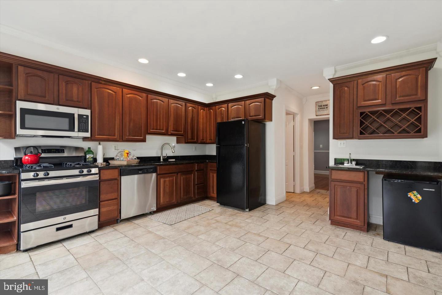116 Dawson Street Philadelphia, PA 19127 - Photo 4 of 14 Modern kitchen with rich wood accents.