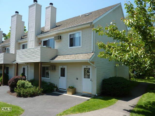 136 Pembroke Road, Unit 26 Danbury, CT 06811 - Photo 1 of 1 a front view of a house with garden