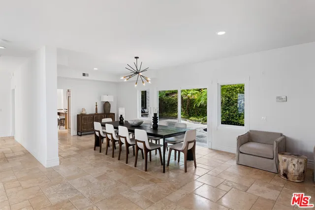 a kitchen with stainless steel appliances granite countertop a stove and a sink