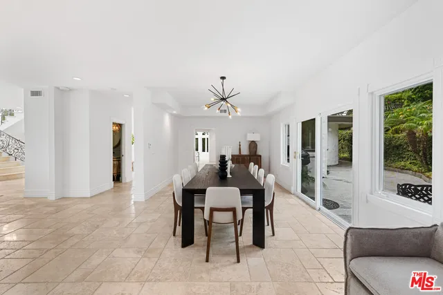 a kitchen with stainless steel appliances granite countertop a sink and cabinets