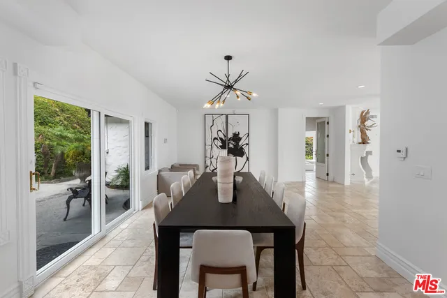 a kitchen with a sink stove top oven and cabinets