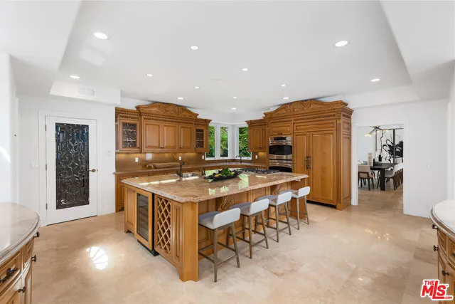 a view of a livingroom with furniture and floor to ceiling window