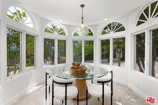 a bathroom with a bathtub and window