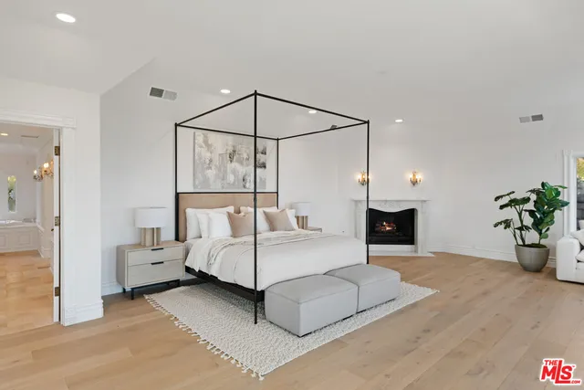 a living room with patio furniture and a large window