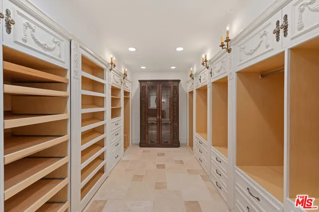 a view of a house with a yard and large tree