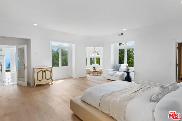 a view of a park with a tree in front of the house