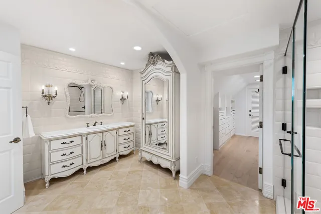 a view of a street with houses on both side of it