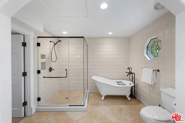 an aerial view of residential house with outdoor space and street view