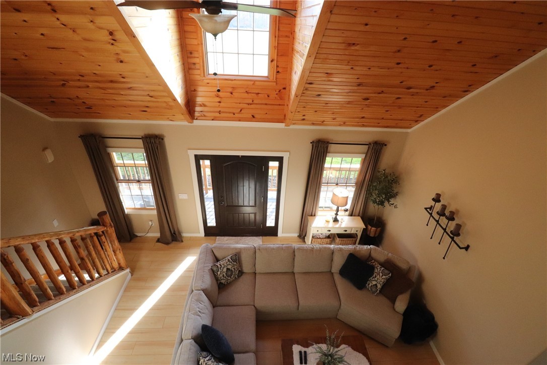 10582 Irvin Road Creston, OH 44217 - Photo 14 of 47 Living room featuring high vaulted ceiling, ceiling fan, light hardwood / wood-style flooring, and wood ceiling