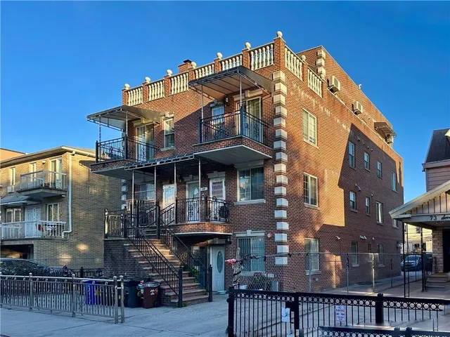 a front view of a building with glass windows