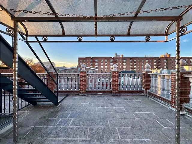 a view of a room with wooden floor and a window