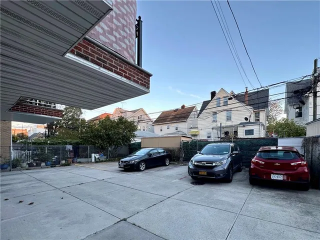 a view of parking with cars parked