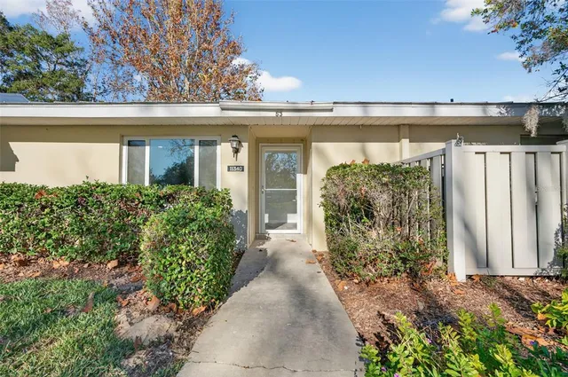 front view of a house with a garden