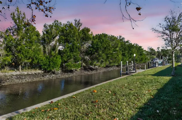 a view of a lake with a house in the background