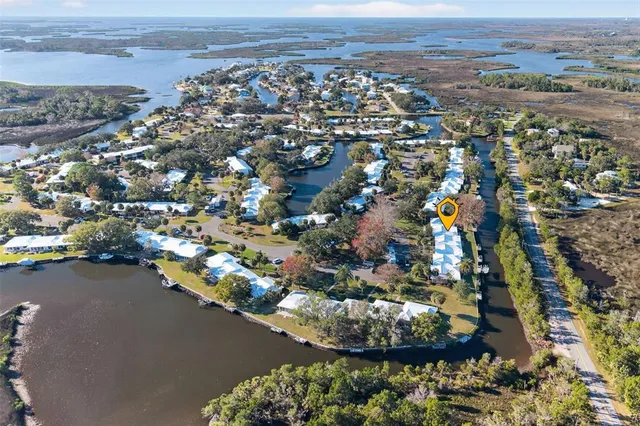 an aerial view of a houses with a lake view