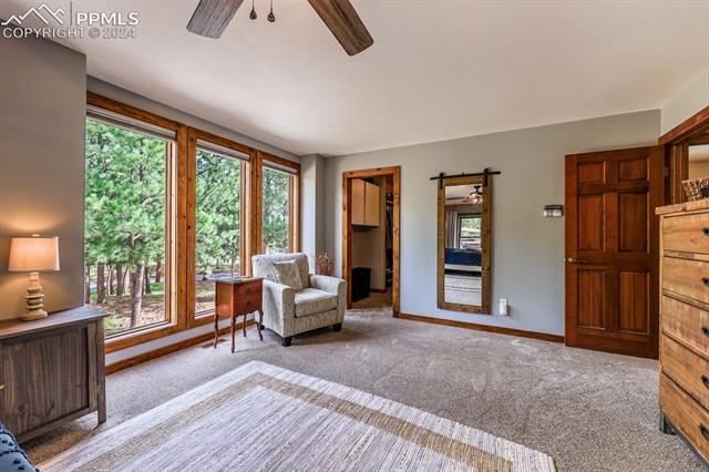 475 Cimarron Road Monument, CO 80132 - Photo 15 of 34 Stunning Sitting Area in Primary Bedroom. Gorgeous Views!