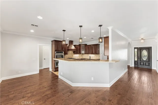 a view of entryway with wooden floor