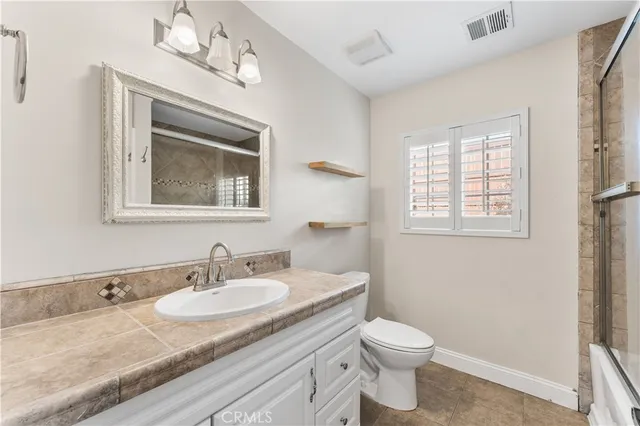 a view of an empty room with a fireplace