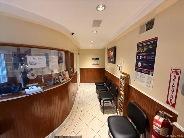 a living room with furniture a flat screen tv and a large window