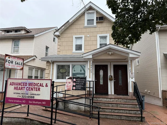 a view of a brick building with many windows