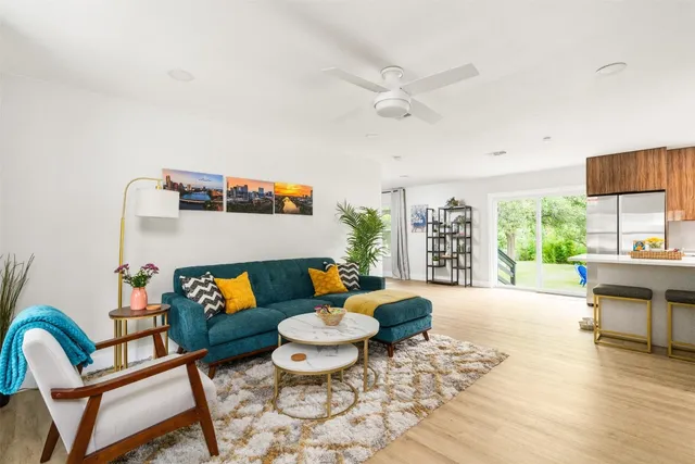 a living room with furniture and a window