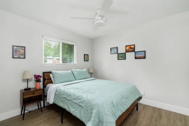 a bedroom with a bed and a desk