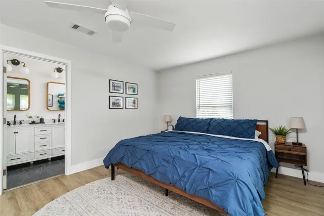 a bedroom with a bed and a dresser