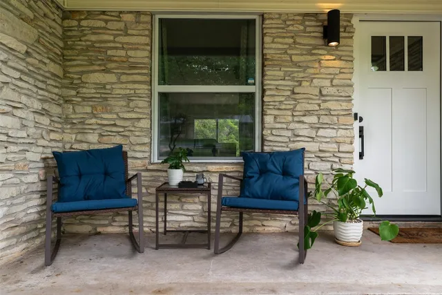 a brick building with a bench in front of it