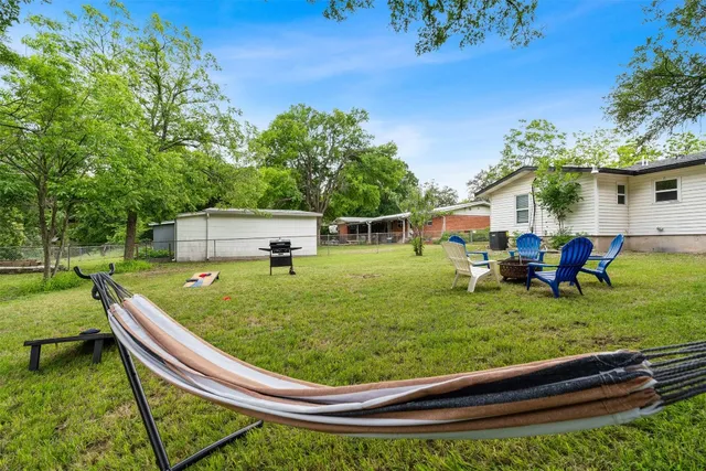a view of a wooden deck with a yard
