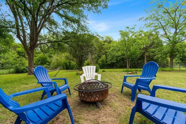 a view of a chairs and table in the patio
