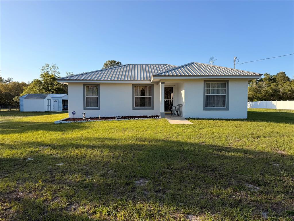 472 Shaw Lake Road Pierson, FL 32180 - Photo 1 of 1 a view of a house with a yard